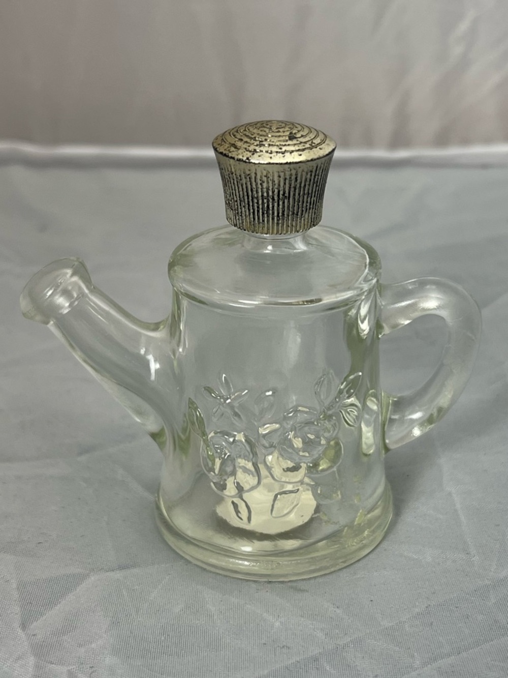 Vintage Avon "Field Flowers" cologne bottle shaped like a miniature watering can